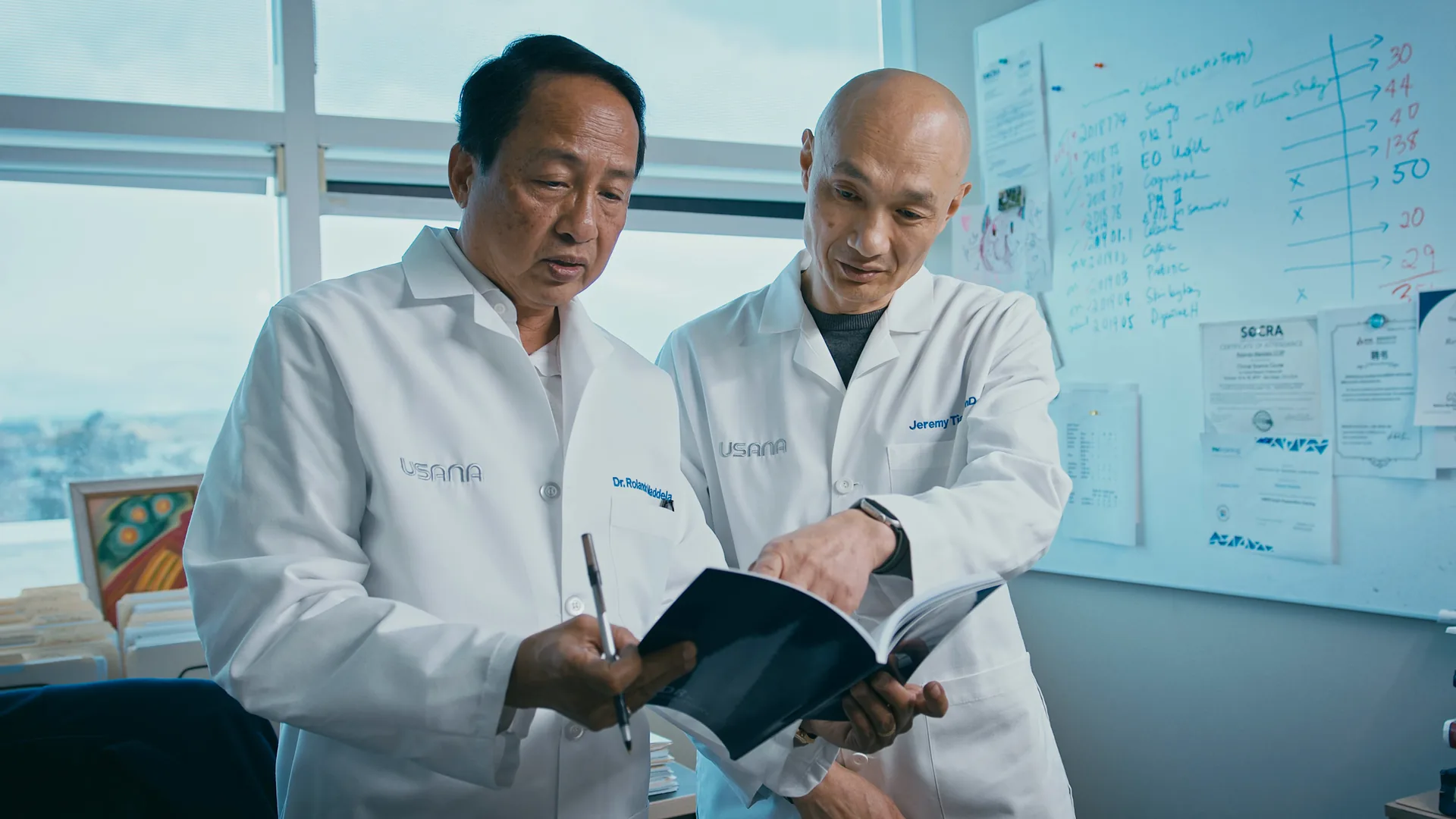 Two scientists reviewing notes