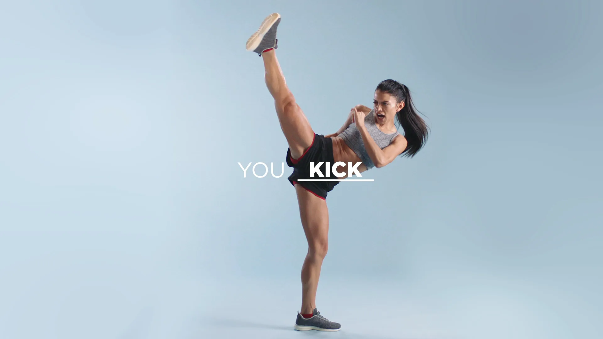 Woman mid high-kick: You kick