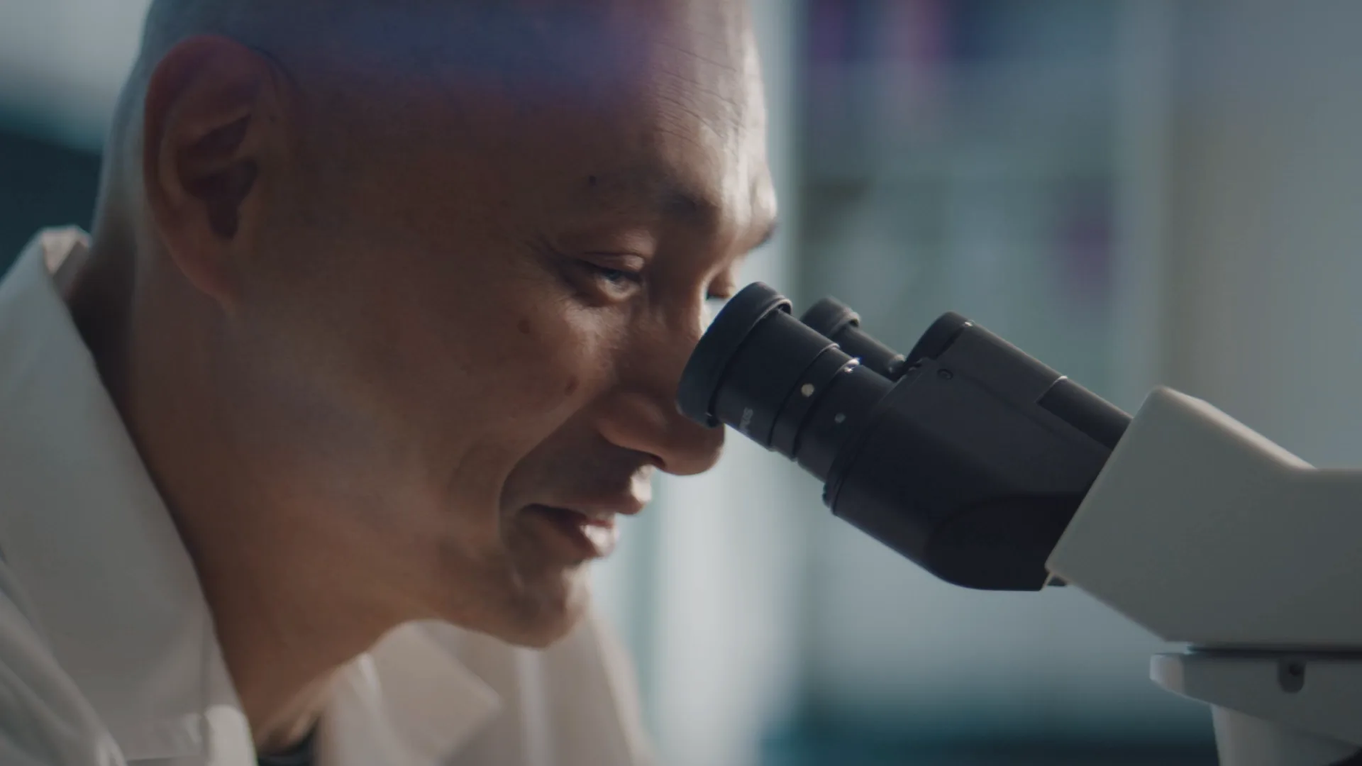 Scientist at a microscope