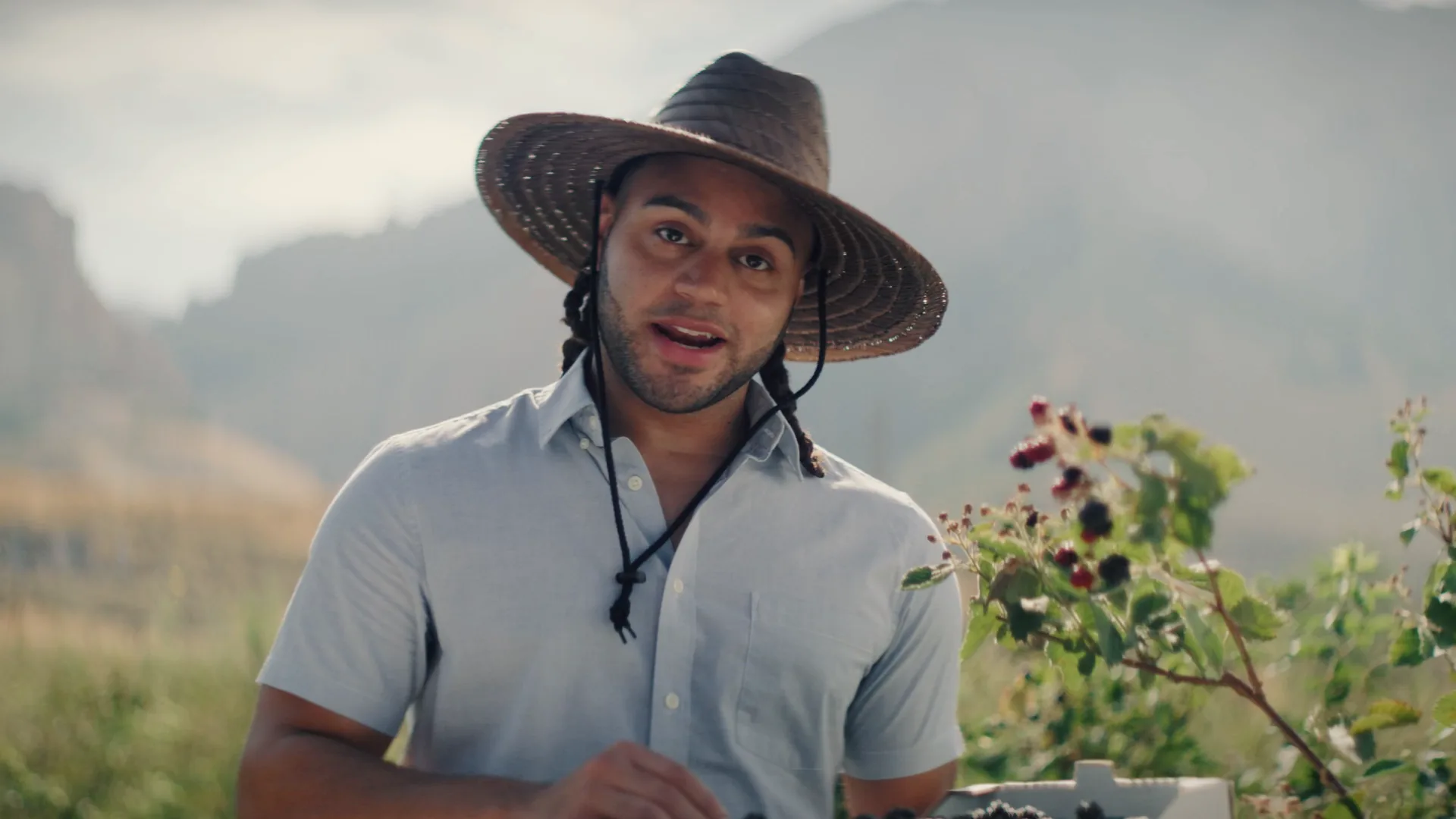Farmer in a straw hat in a field