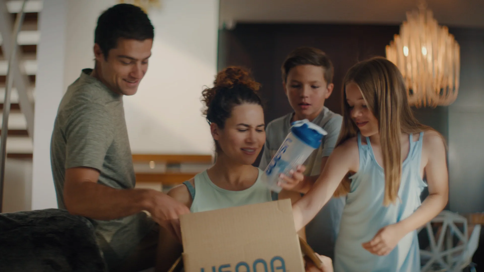Family unboxing a USANA delivery